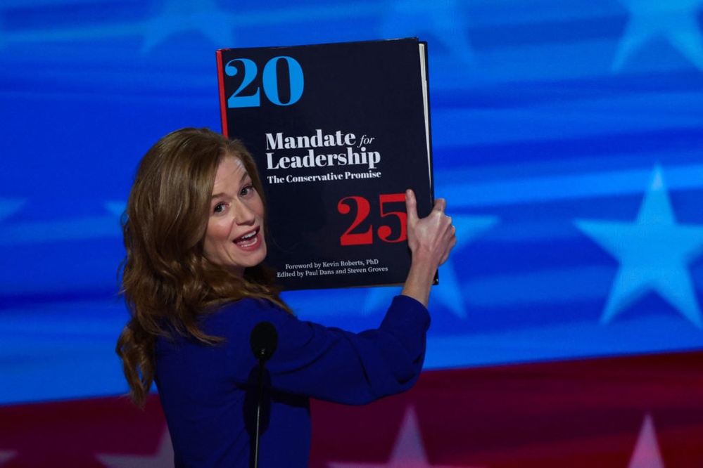 WATCH: Hauling large copy of Project 2025, Michigan state Sen. McMorrow speaks at 2024 DNC