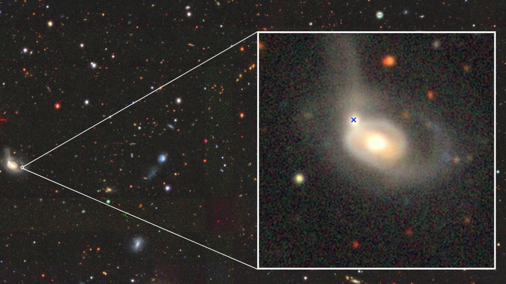 Astronomers discover black hole ripping a star apart inside a galactic collision. 'It is a peculiar event'
