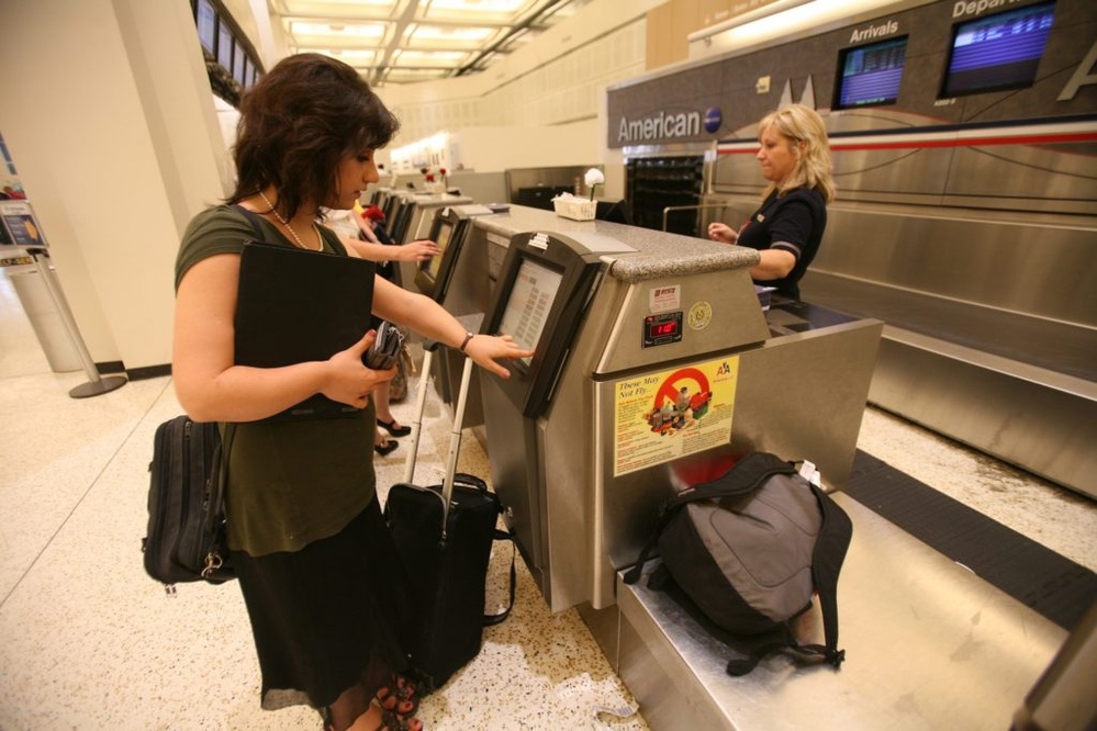 Travelers feel the pinch as major airlines cash in on added service fees