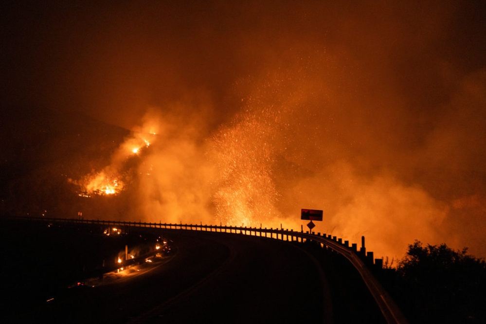 Wildfire burning east of Los Angeles forces evacuations and threatens 35,000 structures