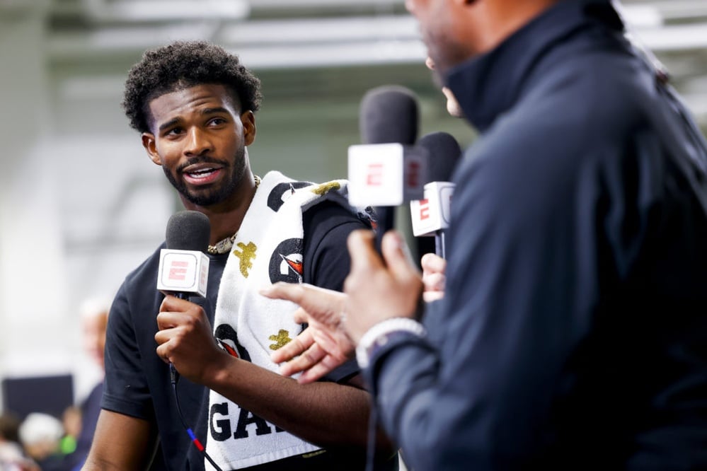 Why did college football star Shedeur Sanders fall to the fifth round in the NFL draft?