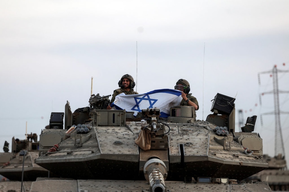 Hospitals overwhelmed as Gaza siege intensifies and Israel vows Hamas will 'be crushed'