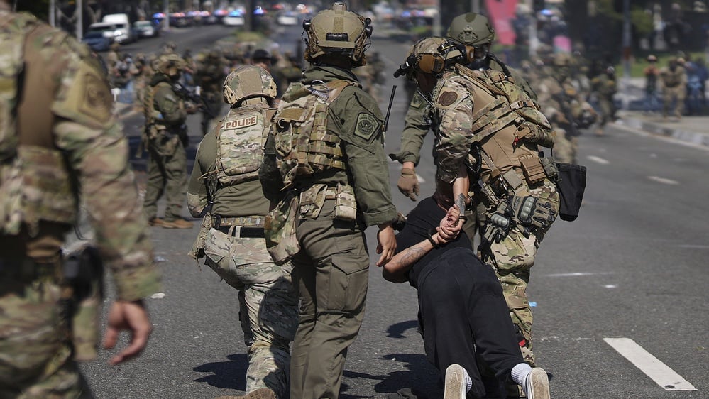 Trump's deployment of troops to handle immigration protest tension in LA.