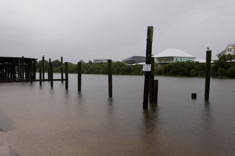 Francine weakens moving inland as the storm leaves behind flooding and widespread power outages