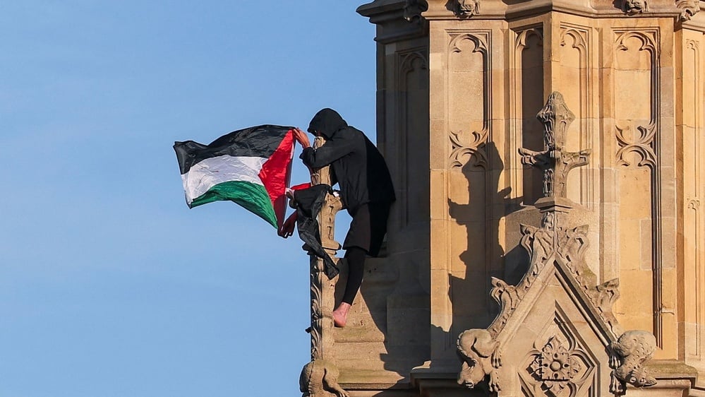 Protester climbs Big Ben waving Palestinian flag for 16 hours