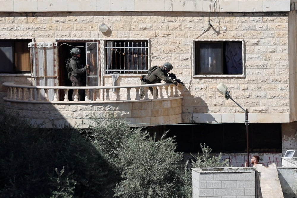 During a West Bank raid, Israeli soldiers pushed 3 apparently lifeless bodies from roofs