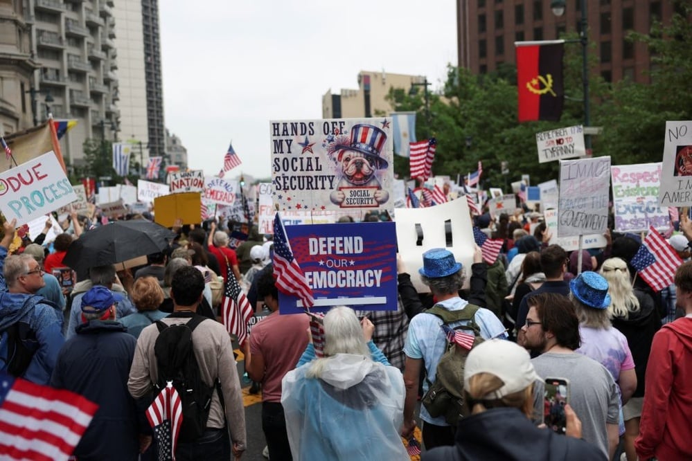 Nationwide protests and a military parade mark political divide