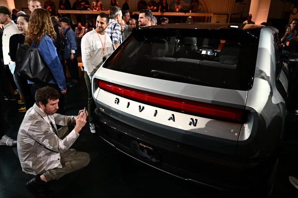 Volkswagen invests $5 billion in Rivian to bolster EV production and technology.