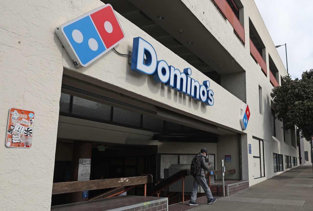 Domino's U.S. same-store sales slip as cooling economy chills pizza maker's profit