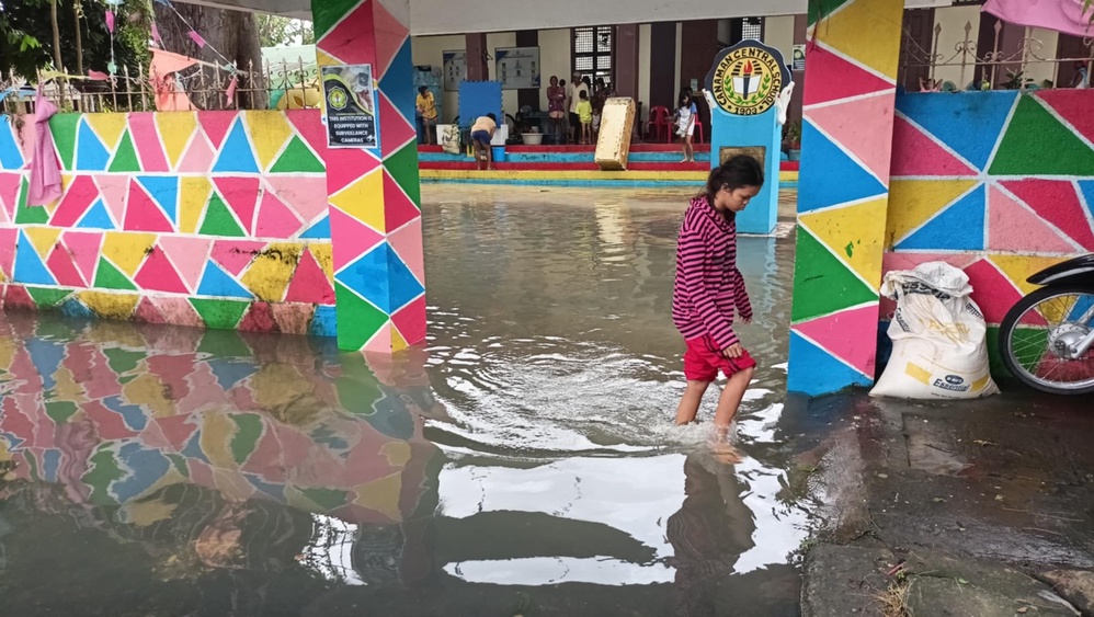 Trough of Severe Tropical Storm Kristine causing scattered rain