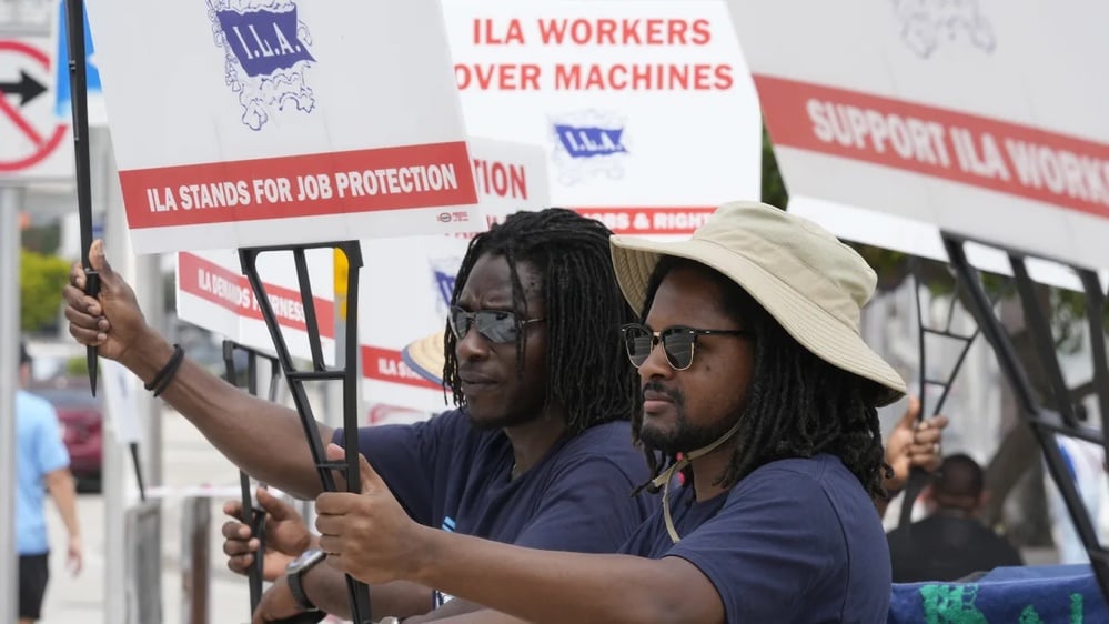 Dockworkers end strike, securing a significant tentative wage increase.