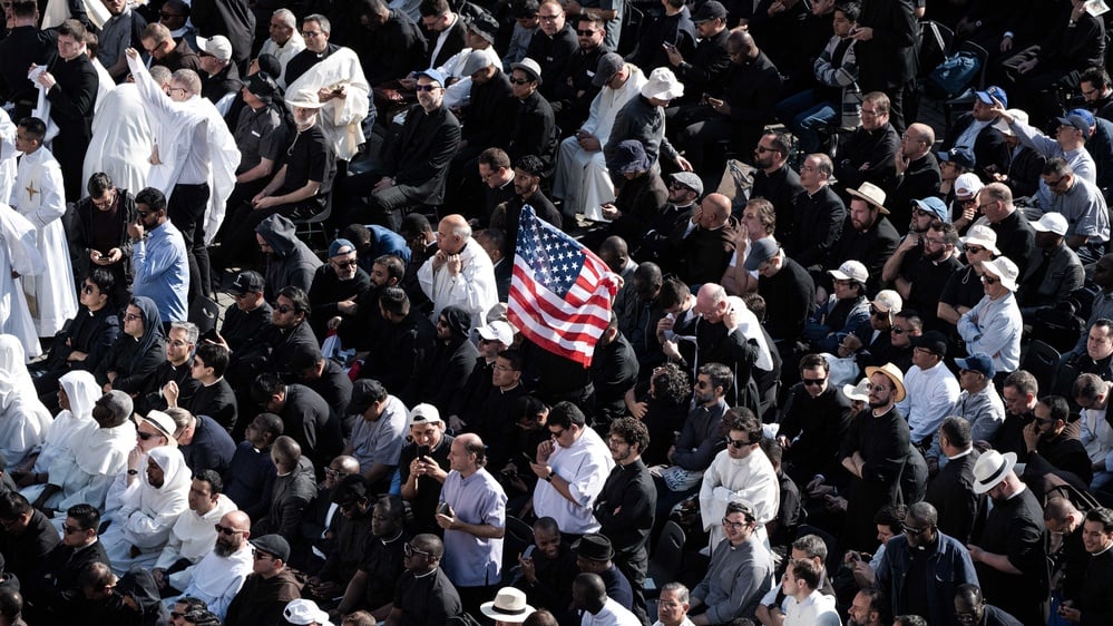 First American pope elected, emphasizing global unity and peace.