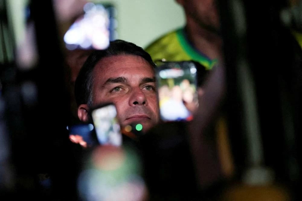 Flavio Bolsonaro beat polls to lead Brazil's first round at 47.45% versus Lula's 44.66%, setting an October 25 runoff as markets surge