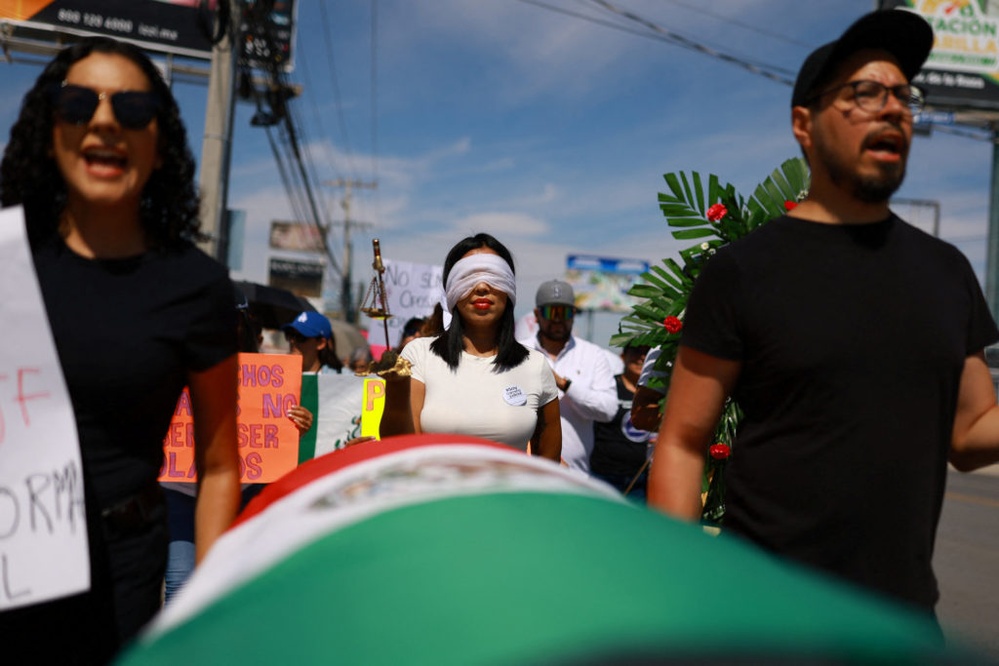 Protesters in Mexico march against outgoing president's judiciary overhaul plan