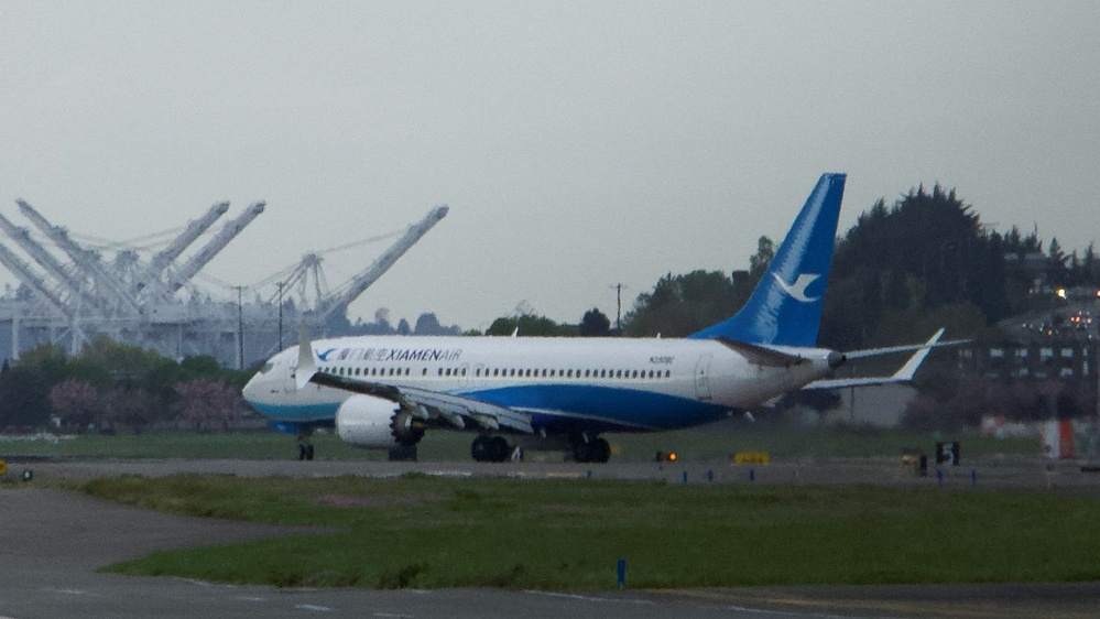 Boeing 737 Max, adorned with a Chinese airline's logo, returns to US soil