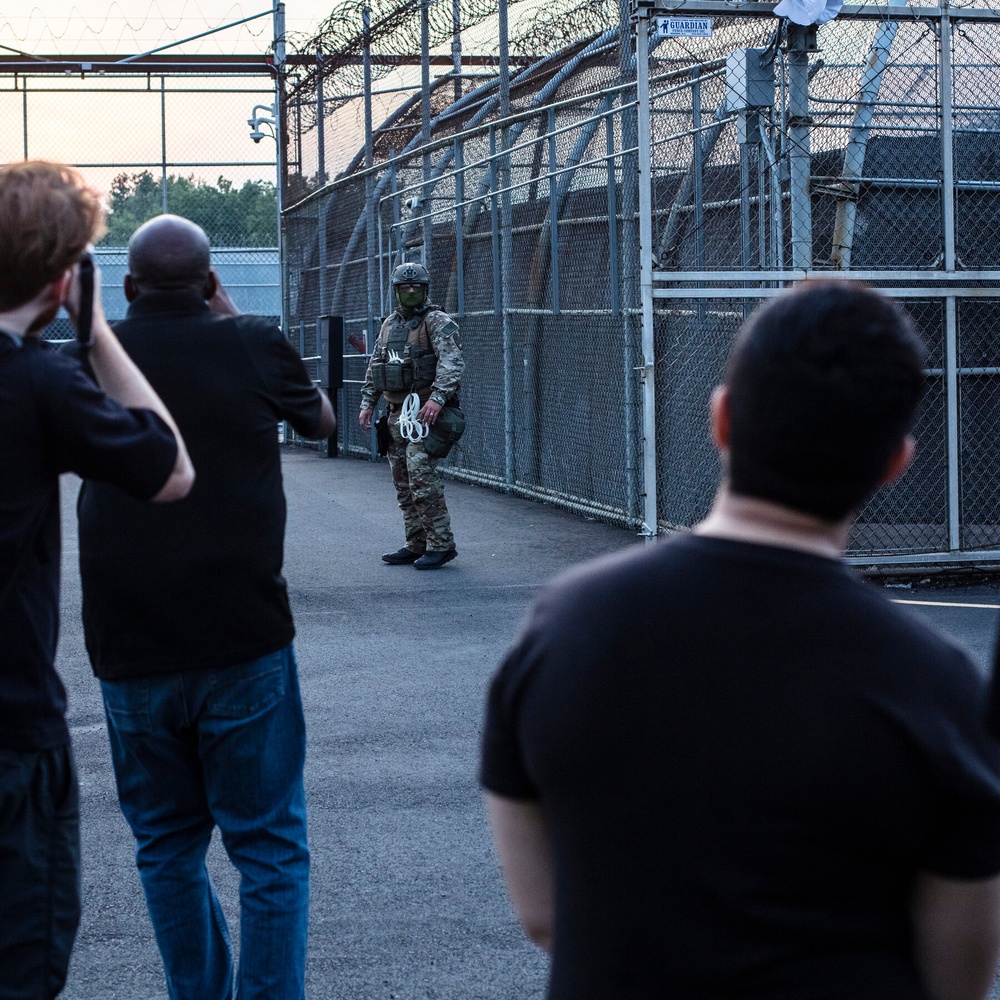 Law Enforcement Officers Respond to Reports of Unrest at Migrant Facility