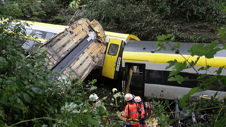 Train derailment in Germany due to landslide; three fatalities reported.